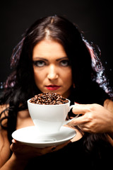 Young Woman Holding A Cup Of Coffee