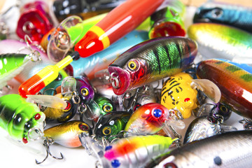 Set of fishing spinners and wobblers multi-colored background