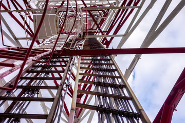 high voltage tower with connected horizontal vertical diagonal metal pylons