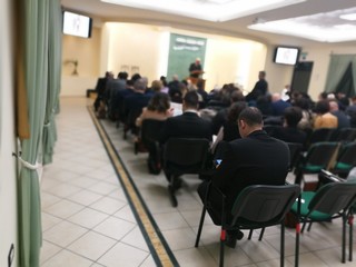 People seated at a business conference - obrazy, fototapety, plakaty