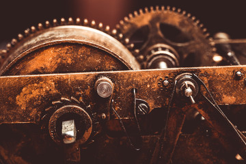 Old clockwork dirty with dust and lubricating oil. Selective foc