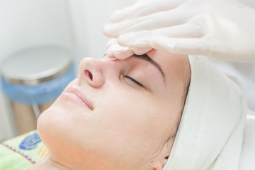 Obraz na płótnie Canvas Facial massage.Beautiful young woman getting facial massage in beauty salon