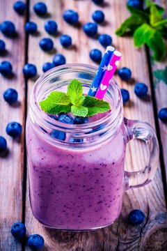 Blueberry smoothie with mint in mason jar