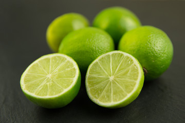 Lime fruits on dark background