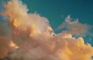 Sky with a fluffy clouds at sunset