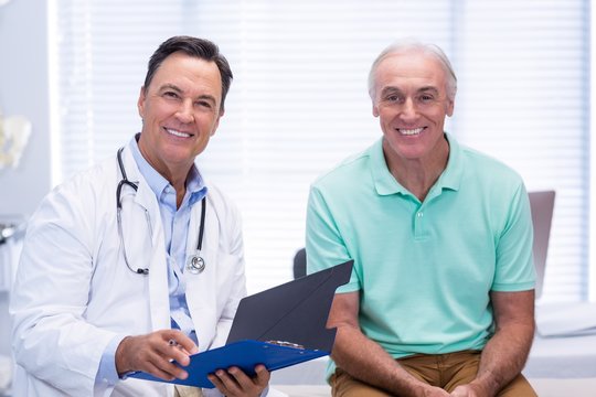 Portrait of smiling doctor and senior patient