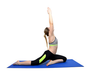 Young woman doing yoga on the mat isolated on white background.