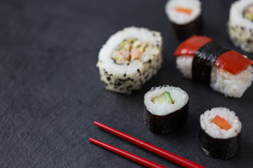 Sushi platter closeup with chopsticks