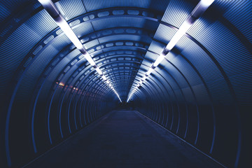 Modern city tunnel at night with lights