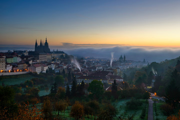 Amazing foggy morning near St. Vitus Cathedral and Lesser town, Prague, Czech republic.