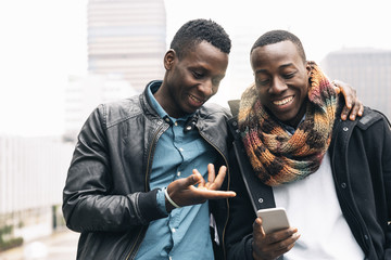 Business men using mobile in the Street.