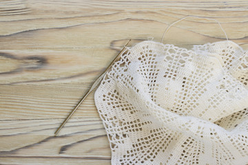 The beginning of handmade crocheted cotton organic doily flower. Old metal crocheting hook. Needlework creative craft, Mori Girl lace style