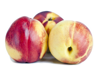 Ripe nectarines on a white background