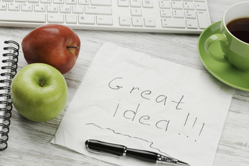 Napkin with message on workplace . Mixed media