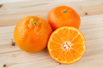 Tangerines on a wooden background