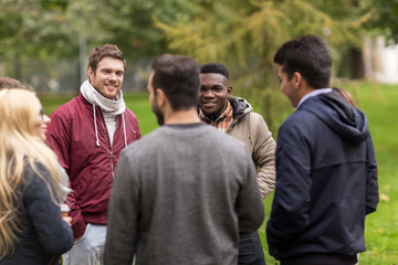 group of happy international friends outdoors