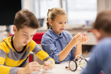 Fototapeta premium happy children building robots at robotics school