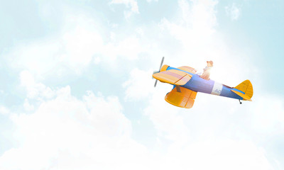 Student girl in old airplane . Mixed media . Mixed media