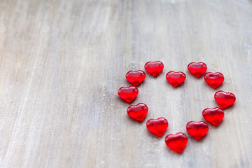 Marmalade in the form of hearts laid out in the shape of a large heart on wooden boards