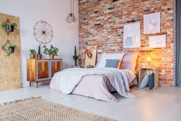 Bright bedroom with brick wall