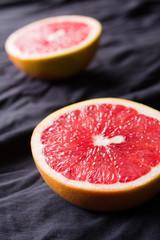 Cutted grapefruit on a dark background