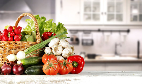 Fototapeta vegetables on wooden table in kitchen space 