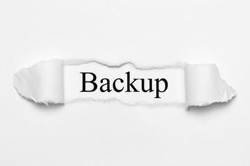 Backup on white torn paper
