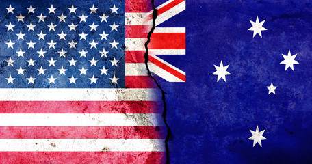 A large crack in the wall. USA flag. Flag of Australia