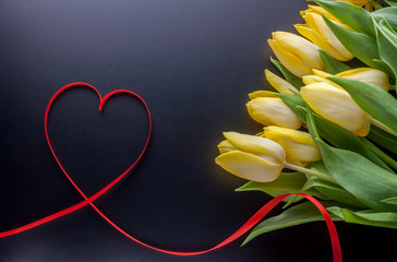 yellow tulips and red tape heart