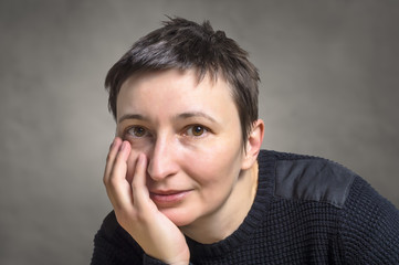 Portrait of smiling young adult woman.