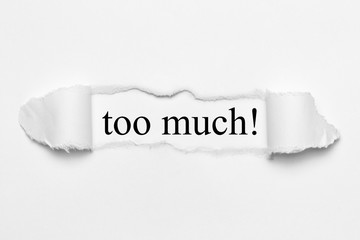 too much! on white torn paper