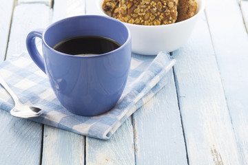 coffee oatmeal cookies breakfast kitchen blue wooden background
