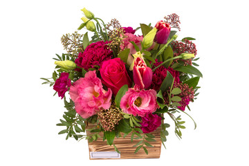 Bright buketny composition from fresh flowers, the white isolated background
