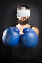 Boxer with VR glasses and blue gloves