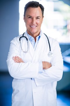 Portrait Of Doctors Standing With Arms Crossed