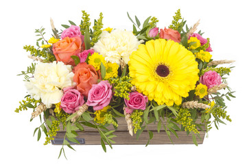 Bright buketny composition from fresh flowers, the white isolated background
