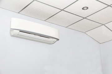 Air conditioner on wall background in white room,conditioning