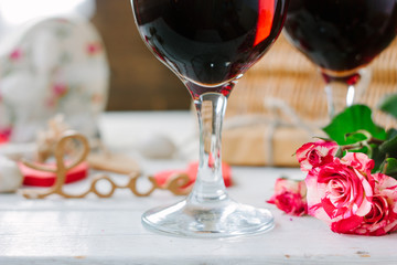 Flowers and glasses of wine on celebration of Valentine's day