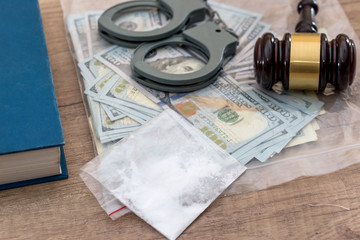 Drugs and substances prohibited, dollar, book,  Judge gavel and handcuffs - arrest criminals