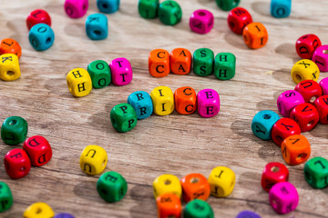 Word "hot price" of the colored wooden cubes on wooden desk.