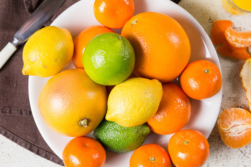 different kinds of citrus on white background