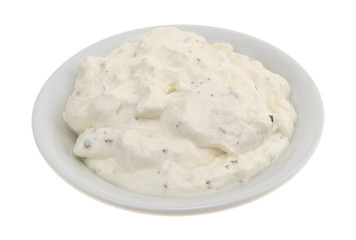 Small bowl of French onion dip isolated on a white background.
