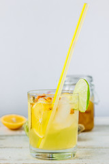 Fresh Ginger lemonade over white wooden background