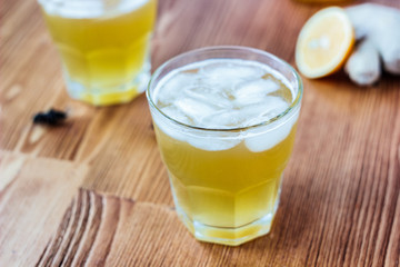 Alcohol free home ginger beer on glass on wooden surface