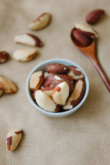 Brazil nuts in white ceramic bowl.