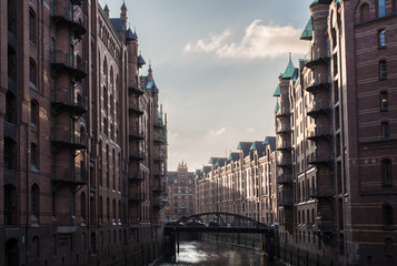 buildings and channel in the old warehouse district Speicherstadt in Hamburg, Germany