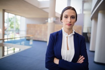 Confident businesswoman with arms crossed
