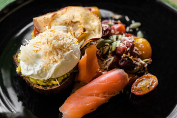 Bread from avocado and poached Eggs, breakfast. Tasty sandwich w