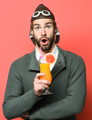 Fototapeta premium bearded pilot with cocktail in glass