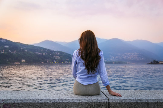 Young Woman Admiring Sunset At The Lake Como